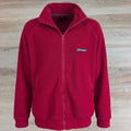 Berghaus red full-zip fleece jacket flat lay on wood background